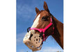 Chestnut horse wearing a Harmany Grazing Muzzle.