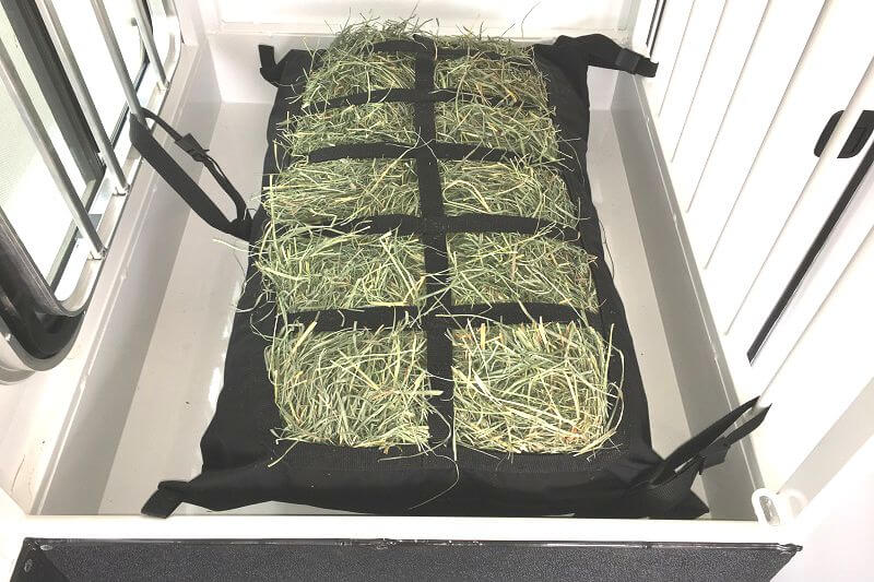Manger Hay Pillow 4" x 6" mesh size filled with hay attached inside front load manger horse trailer.