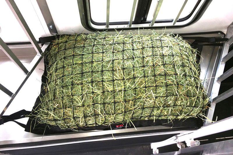 Manger Hay Pillow 1 3/4" mesh size filled with hay attached insdie slant load manger horse trailer.
