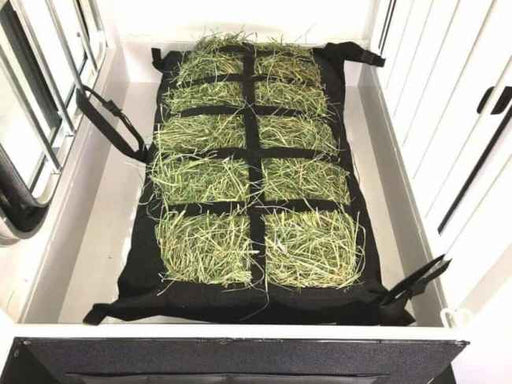 Manger Hay Pillow Horse Trailer Hay Bag filled with grass hay attached in front load horse trailer manger.