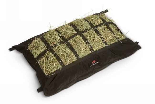 Manger Hay Pillow Horse Trailer Hay Bag filled with hay 4" x 6" mesh size.
