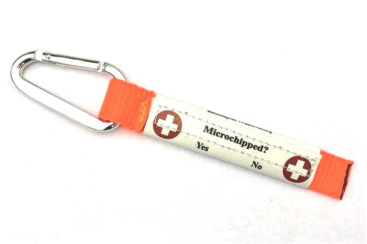 Back of neon orange Ultralite Emergency Info ID Clip-on Tag. showing Microchipped Yes/No status.