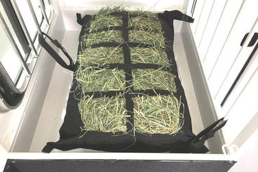 Manger hay bag in a straight load horse trailer