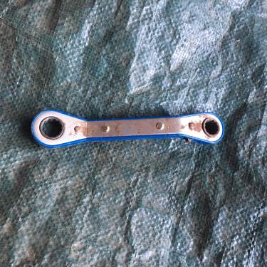 Offset ratchet wrench to free a cast horse donkey or mule horse keeping tip